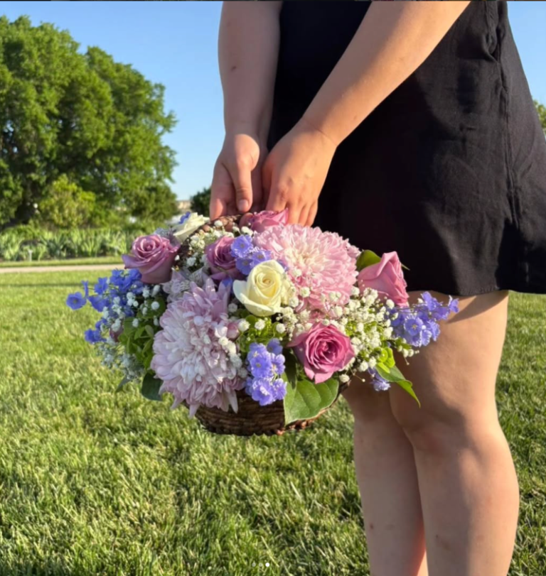 Pink dahlias and blue delphinium basket arrangement